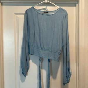 Cropped denim style blouse.
